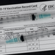 vaccine card with syringes